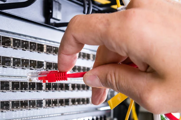 Hand Administrator Plugging Red Patch Cable Empty Switchboard — Stock Photo, Image