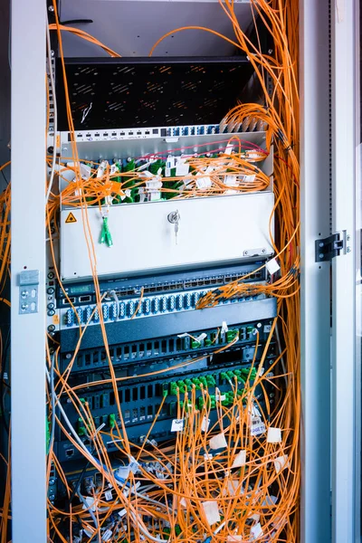 data center with servers and fiber optic cables
