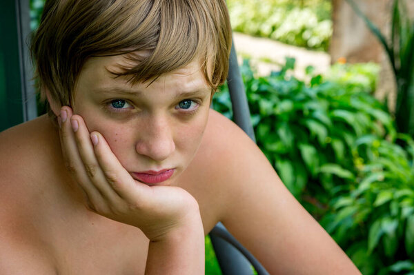 Portrait of a young man with blue eyes close-up. He smiled at the photographer.