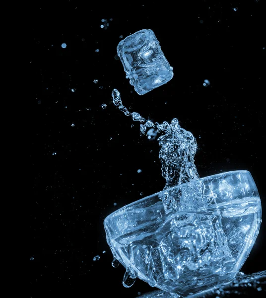 Ice cube blue water wave splash motion — Stock Photo, Image