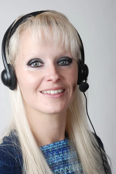 Portrait of young woman with headset — Stock Photo, Image