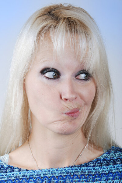 Young blond woman making a face