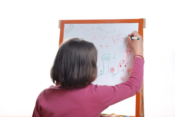 Young girl drawing on the white board Stock Photo