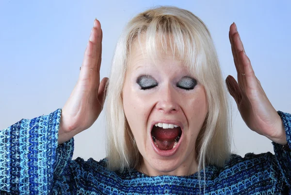 Young blonde woman with a cry — Stock Photo, Image