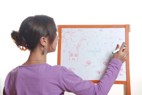 Young girl drawing on the white board — Stock Photo, Image