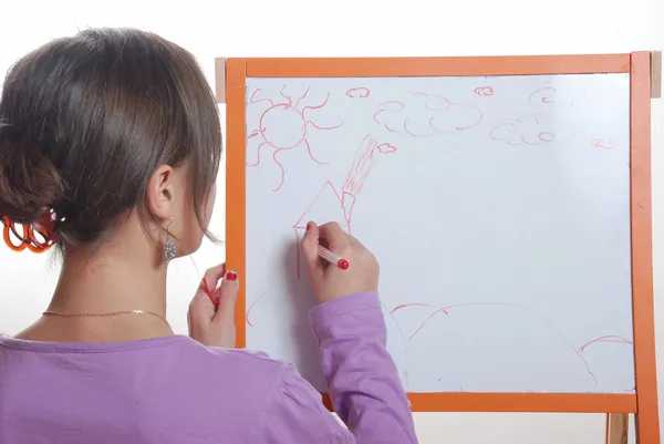 Young girl drawing on the white board — Stock Photo, Image