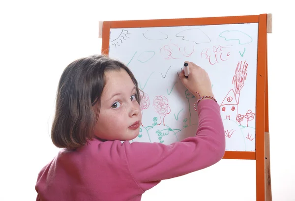 Młoda dziewczyna rysunek na tablicy biały — Zdjęcie stockowe