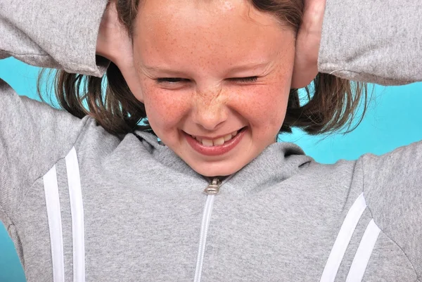Girl covering her ears — Stock Photo, Image