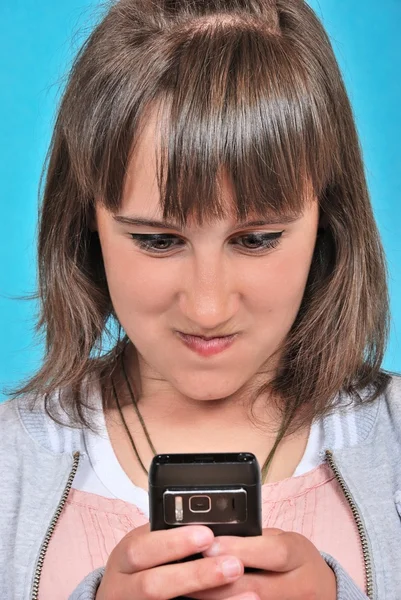 Menina com um telefone celular — Fotografia de Stock