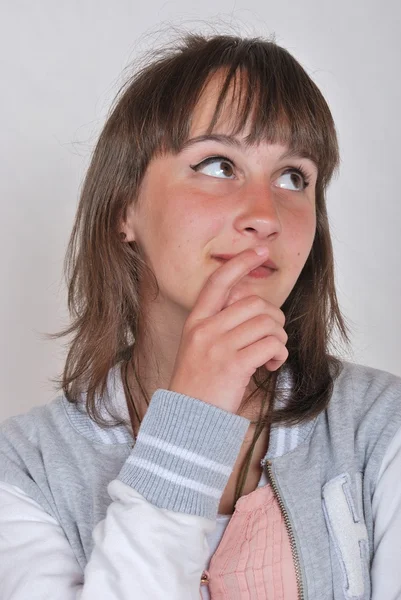 Girl thinking and looking somewhere up — Stock Photo, Image