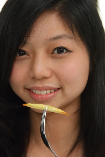 かなりアジアの女性を食べる ロイヤリティフリーのストック画像