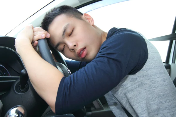 Slaap aan het stuur Stockfoto