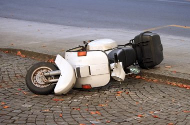 Scooter down on the street clipart