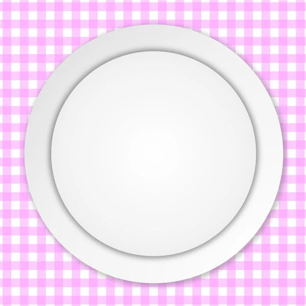 Біла тарілка на рожевій скатертині — стокове фото