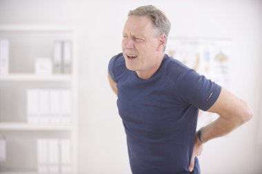 Man suffering from backache clipart
