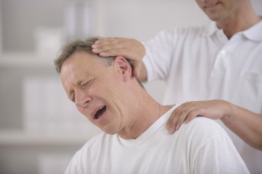 Chiropractic: Chiropractor doing neck adjustment clipart
