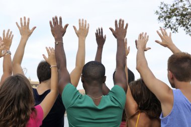 Diverse group raising hands clipart