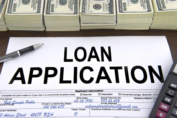 Approved loan application form and dollar bills — Stock Photo, Image