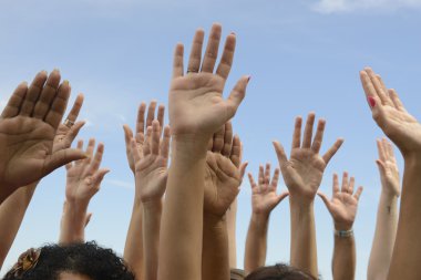 Hands Up against blue sky clipart