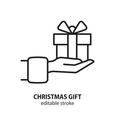 Noel hediyesi kutusu vektör çizgisi ikonu olan bir el. Düzenlenebilir vuruş.