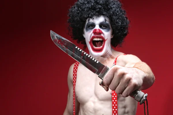 Spooky Clown Holding a Bloody Knife — Stock Photo, Image