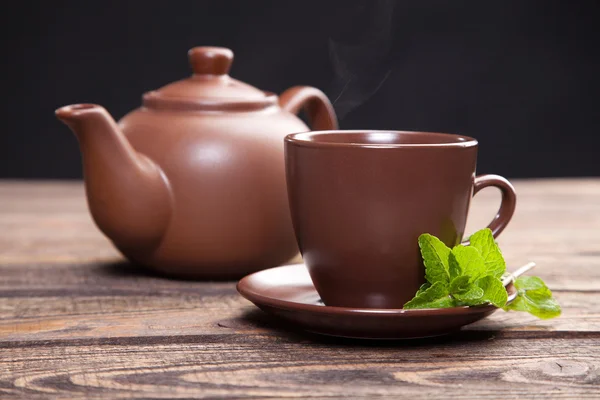 Tea with mint on a wooden table — Stock Photo, Image