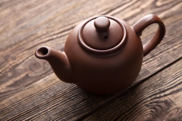 Teapot on a wooden table — Stock Photo, Image