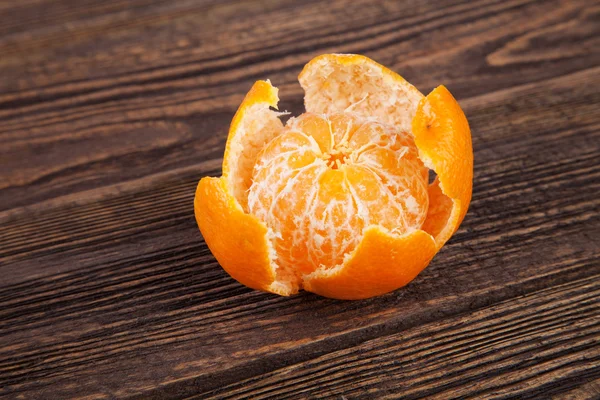 Peeled tangerines on a table — Stock Photo, Image