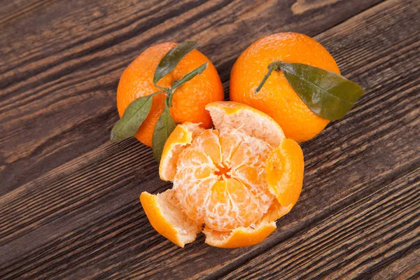 Peeled tangerines on a table — Stock Photo, Image