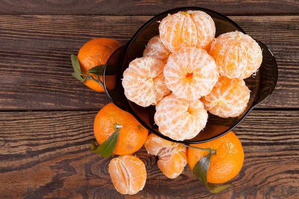 Peeled tangerines on a table — Stock Photo, Image