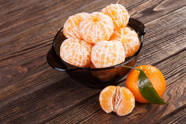 Peeled tangerines on a table — Stock Photo, Image