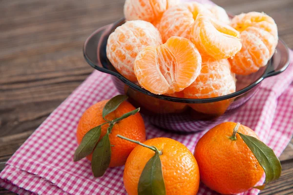 Peeled tangerines on a table — Stock Photo, Image