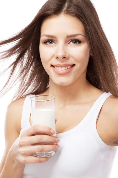 Beautiful slim woman with a glass of milk — Stock Photo, Image