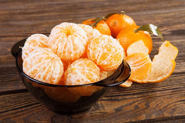 Peeled tangerines on a table — Stock Photo, Image