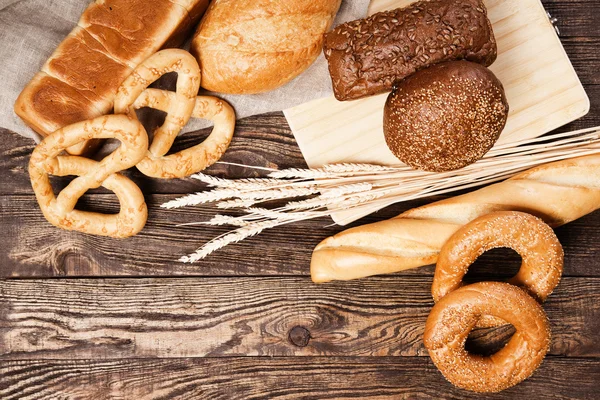 Bread assortment on a wooden table — Stock Photo, Image