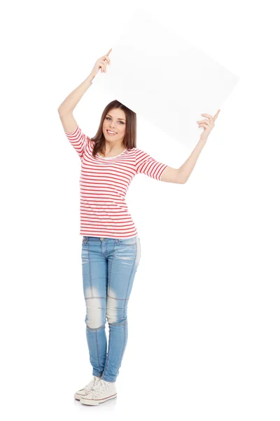Příležitostné mladá žena držící bílou tabuli — Stock fotografie