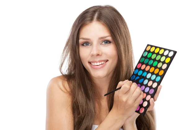 Beautiful woman holding a makeup palette — Stock Photo, Image