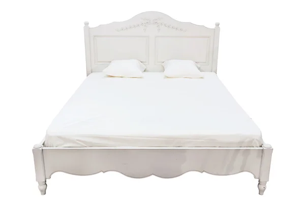 Duże łóżko na białym tle — Zdjęcie stockowe