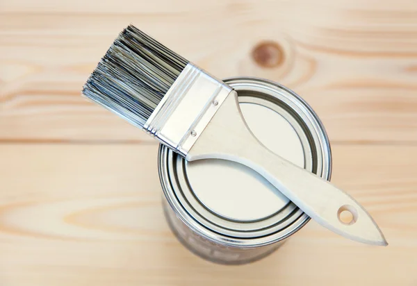 Paint brushes on wooden planks — Stock Photo, Image