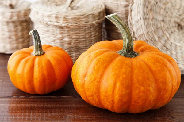 Fresh pumpkins on a wooden table — Stock Photo, Image