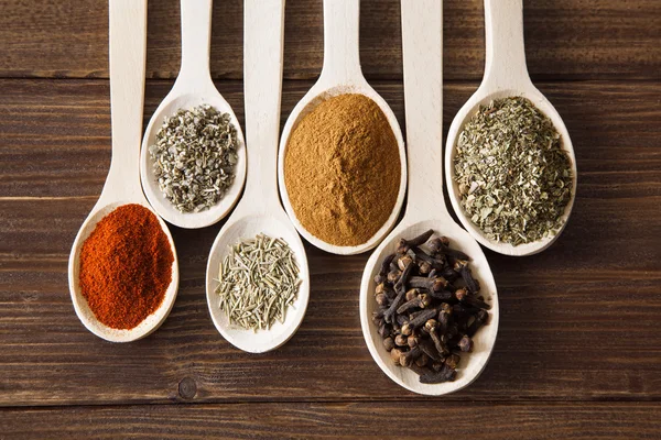 Spice assortment on a wooden table — Stock Photo, Image