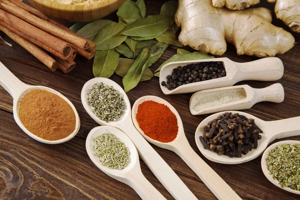 Spice assortment on a wooden table — Stock Photo, Image