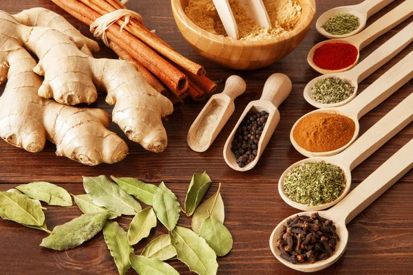 Spice assortment on a wooden table — Stock Photo, Image