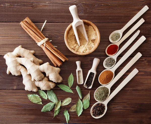 Spice assortment on a wooden table — Stock Photo, Image