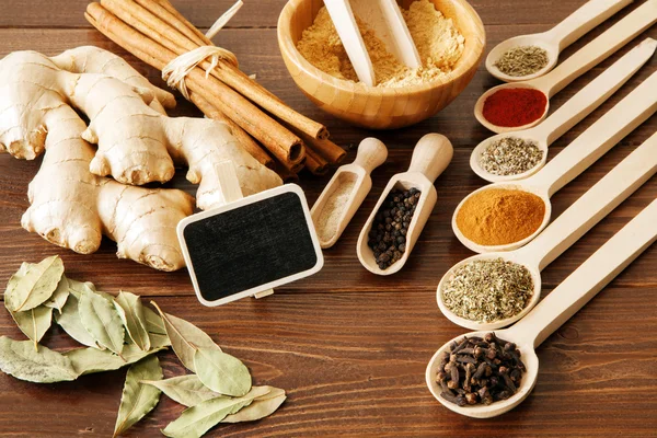 Spice assortment on a wooden table — Stock Photo, Image