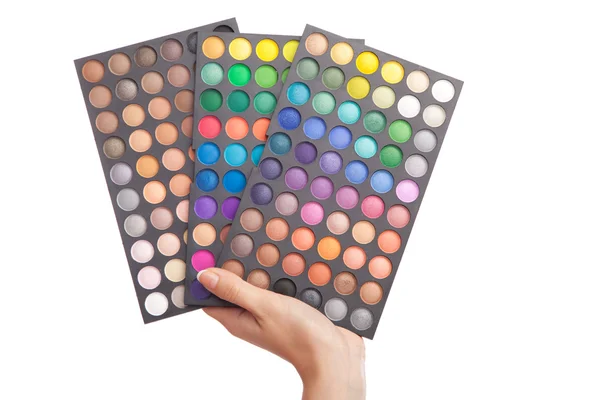 Ženská ruka drží make-up paleta — Stock fotografie