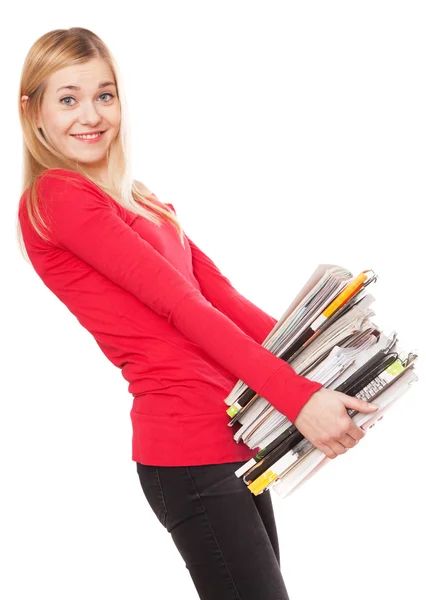 Menina estudante com uma pilha de livros pesados — Fotografia de Stock