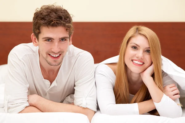 Young couple in bed Stock Picture