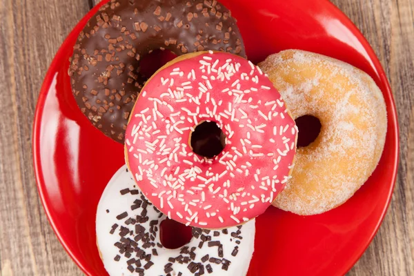 Tasty donut with a cup of coffee — Stock Photo, Image