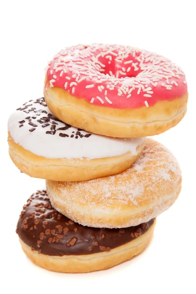 Saborosos donuts no fundo branco — Fotografia de Stock
